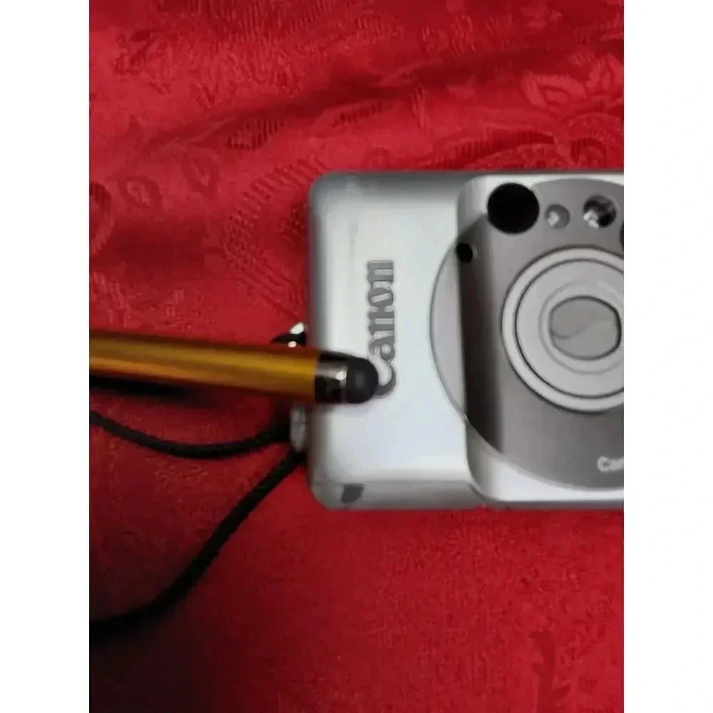 Camera by Canon model lX240 ELPH JR. Includes soft case working Film Camera